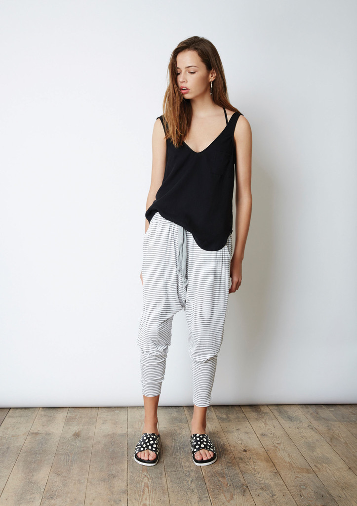 The Venus & Mars Pant is a low waisted track-style pant with a dropped crotch, large front eyelets, drawstring tie and elasticated waistband in a lightweight stretch fabric and The Fifth's exclusive stripe print.